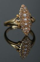 An 18ct gold and pearl navette shaped ring. Size M. 4.98g.