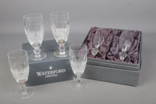 A set of six Waterford Crystal continental champagne glasses in the 'Colleen' design. Two glasses