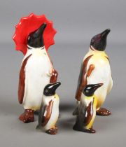 A family of four Beswick penguins.