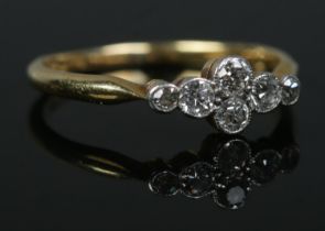 An 18ct gold six stone diamond ring. Size M 1/2. 1.95g.