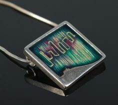 A enamelled silver pendant on silver chain by Shetland Silvercraft. Assay marks for Edinburgh 2013.