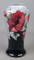 A Moorcroft pottery vase decorated in the Anemone pattern by Walter Moorcroft. Date cypher for 1999.