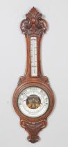 A Victorian carved Aneroid barometer. Hx90cm