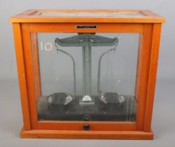 A cased set of Griffin & George chemical scales.