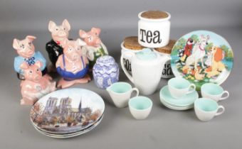 A collection of ceramics including NatWest pigs, Spectrum kitchen cannisters, Poole Pottery tea