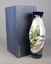 A large Moorcroft pottery vase decorated in the Mountain Kingdom design by Philip Gibson. Signed