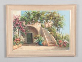 Guido Odierna, A framed oil on canvas of an Italian coastal scene. 84x63cm