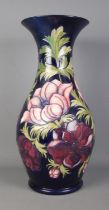 A large Moorcroft pottery floor vase decorated in the Anemone design. Signed J Moorcroft. Date