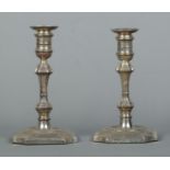 A pair of silver candlesticks with detachable nozzles. Assayed for Sheffield with date marks for