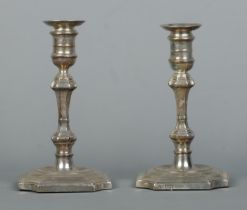 A pair of silver candlesticks with detachable nozzles. Assayed for Sheffield with date marks for