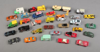 A collection of diecast vehicles including Matchbox and Corgi examples.