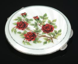 A silver and enamel compact with rose decoration. Assayed Birmingham 1961 by Henry Clifford Davis.