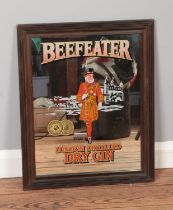 A vintage advertising mirror for Beefeater London Distilled Dry Gin. Approx. dimensions 45cm x 56cm.