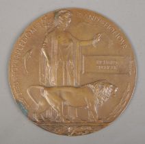 A World War One bronze memorial plaque/death penny awarded to Richard Spencer.