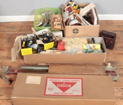 Two boxes of miscellaneous. Includes boxed Orion hand knitting machine, knitting needles, vintage