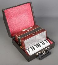 A cased accordion.