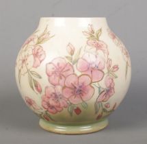 A Moorcroft pottery trial vase decorated in the Spring Blossom design. Dated 12/10/89 to base.