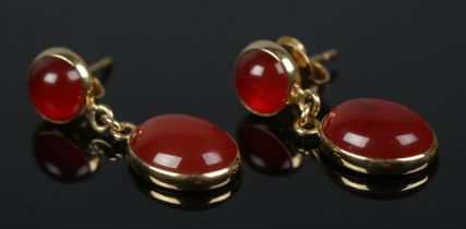 A pair of 18ct gold and carnelian drop earrings. 2.7g.