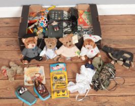 A box of toys and games. Includes Etch A Sketch, parachute action figures, boxed board games,