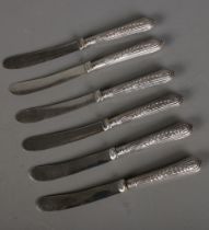 A set of six Edwardian silver handled tea knives assayed Sheffield 1909.