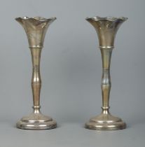 A pair of early 20th century silver vases. Both bearing monograms for WH SH. Makers mark for James