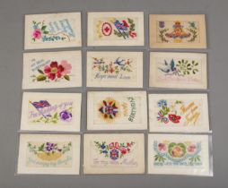 A quantity of World War One silk embroided postcards including three rare examples with secret