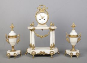 A French alabaster clock garniture with gilt metal mounts by Vincenti & Cie, Paris. Height of