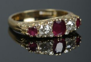 An 18ct gold, diamond and ruby five stone diamond ring. Approximately 0.5ct diamond in total. Size