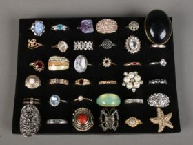 A collection of 36 dress rings.