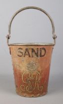 A George V metal fire bucket. Stencilled 'SAND' with crowned GRV cypher. Height 24cm.