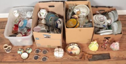 Four boxes of miscellaneous. Includes ceramic figures, dinnerwares, German stein, coloured glass,