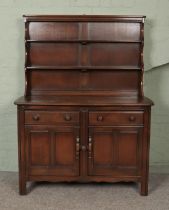 A dark Ercol Old Colonial dresser.