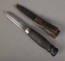 A William Rodgers double edged fighting knife with scabbard. Approx. blade length 8cm. CANNOT POST