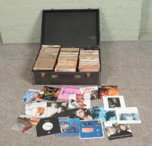 A case of assorted vinyl singles of mainly pop and rock to include Madonna, David Bowie, Frankie