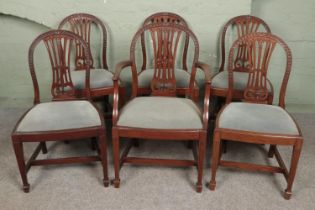 A set of six Hepplewhite style chairs including one carver.