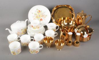 A Wedgwood Summer Bouquet tea service and Noritake gold coffee service. Sets include coffee pot, tea