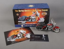 A boxed Franklin Mint 1:10 scale diecast model of The Harley Davidson Road King Classic.