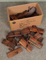 A box of assorted wood working planes including examples stamped by S Copley, H Lockwood, G