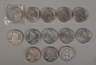 Thirteen commemorative Â£5 coins. Includes five 1997 Princess Diana Memorial examples, seven 2000 UK