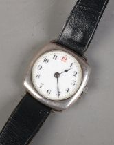A men's silver cased automatic wrist watch on leather strap. Features gilt detailing to face and