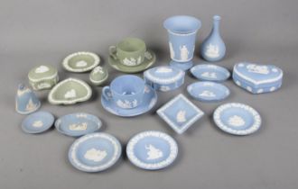 A collection of Wedgwood jasperware in light blue and green to include vase, trinket boxes, cup