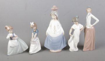 Five Nao by Lladro figures to include girl with flowers and girl seated on a barrel.
