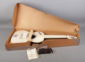 A boxed Elvis Presley Auto-Chord Selco guitar with accessories.