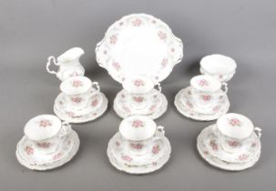 A Royal Albert tea six person tea service in the Tranquility pattern to include cake plate, sugar