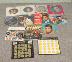 A collection of Elvis Presley vinyl LP records to include I Can Help and Merry Christmas picture