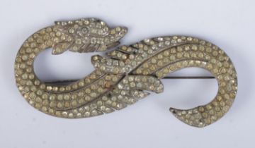 A large white metal paste set dragon brooch. Partial stamp to back, possibly 830 silver. Length
