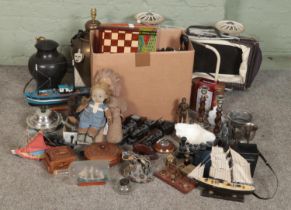 A box of mixed collectable including a selection of vintage board games, leather satchels, carved