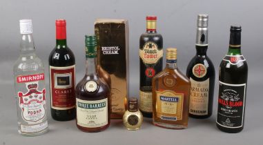 A collection of sealed alcohol. Includes Three Barrels brandy, Martell cognac, Harrods claret,