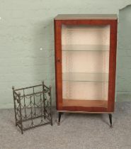 A vintage two-tier glazed display cabinet raised on tapered legs along with small floral wine rack.