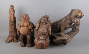 Four Chinese rootwood carvings to include two Buddhas, Tiger and figure of Guanyin Goddess of Mercy.
